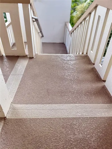 an aerial view of multiple houses with yard