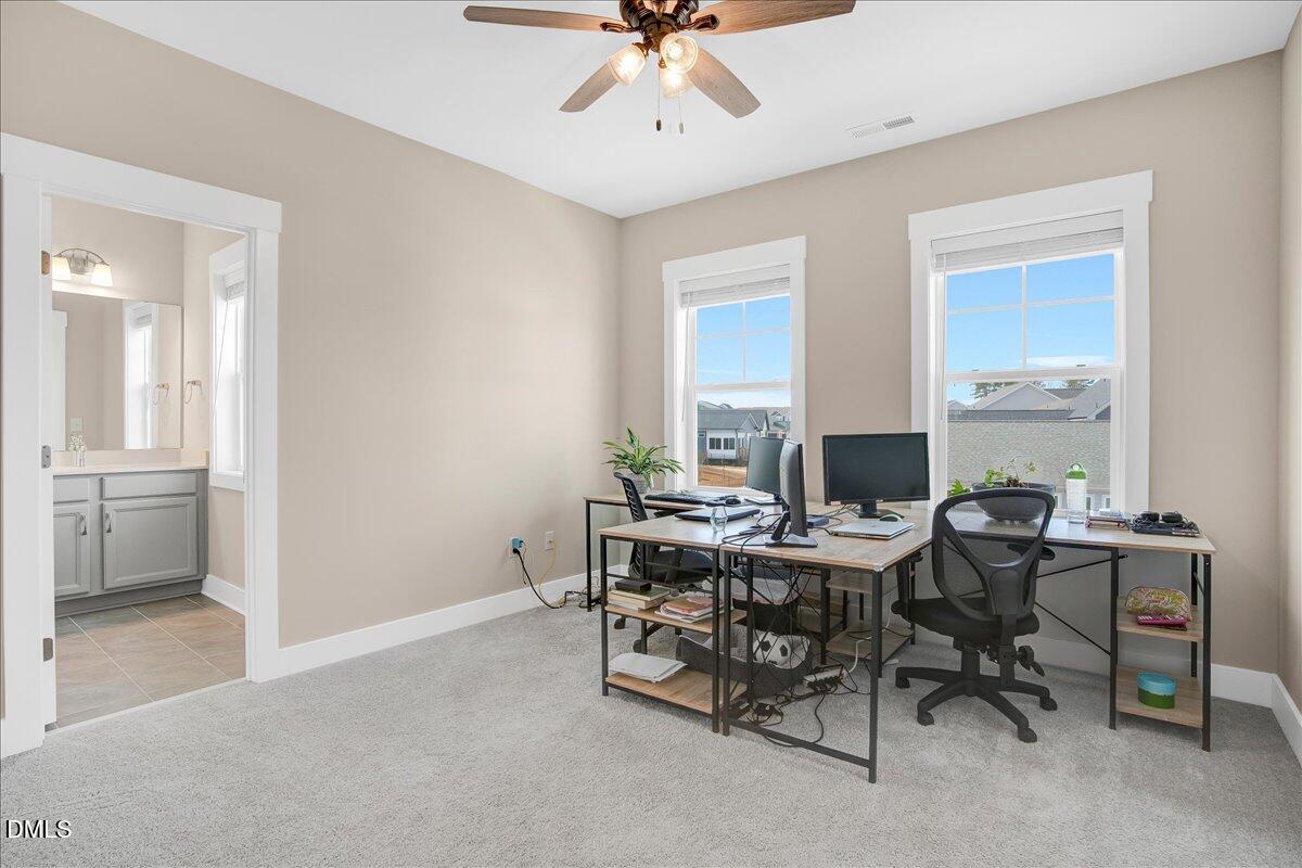 1105 Logperch Way Wendell, NC 27591 - Photo 23 of 29 a view of a workspace with furniture and a window