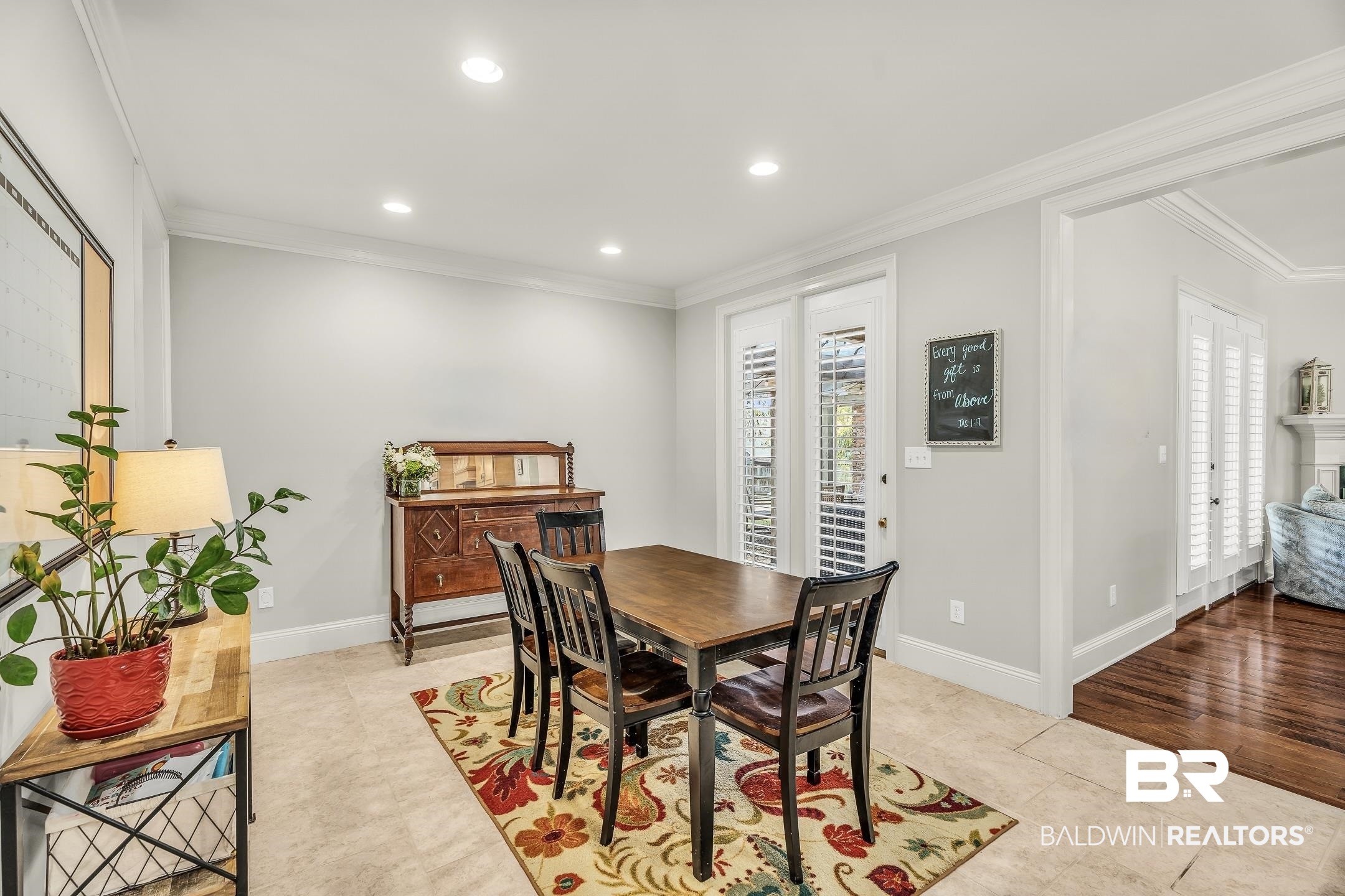 7696 Raegan Lane Daphne, AL 36527 - Photo 15 of 41 Dining area featuring light tile patterned floors and crown molding