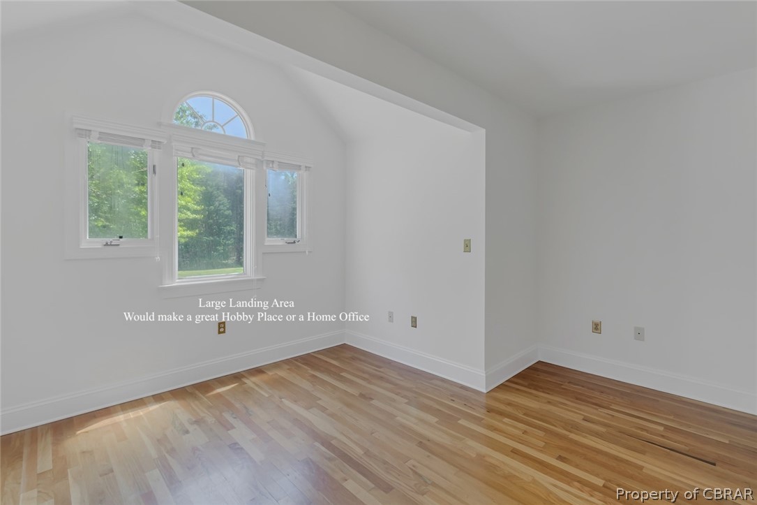 5818 Rivers Landing Terrace, Unit 5818 White Stone, VA 22578 - Photo 26 of 50 Spare room with lofted ceiling and light hardwood / wood-style flooring