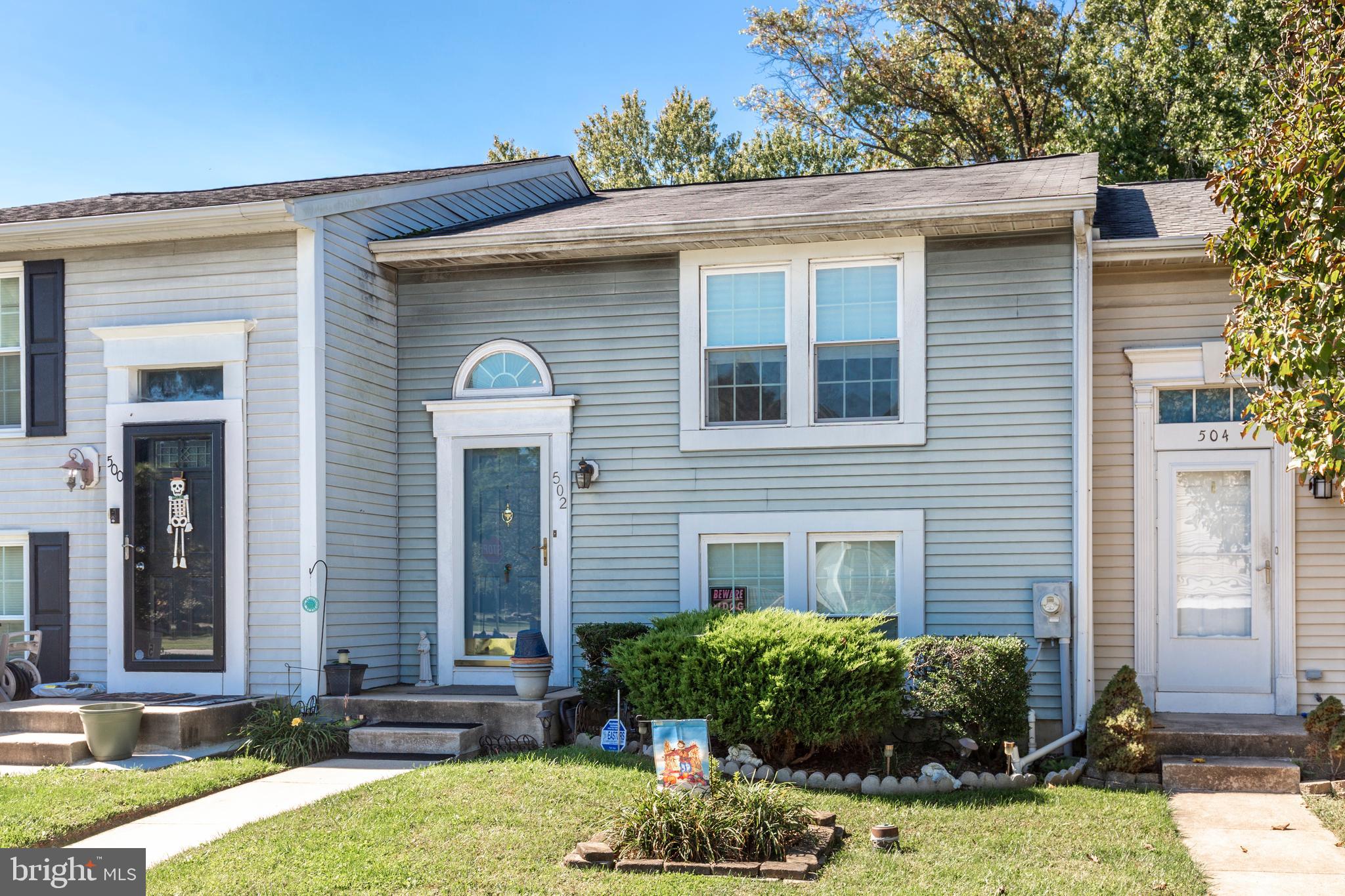 502 Brighton Place Baltimore, MD 21221 - Photo 1 of 42 a front view of a house with garden