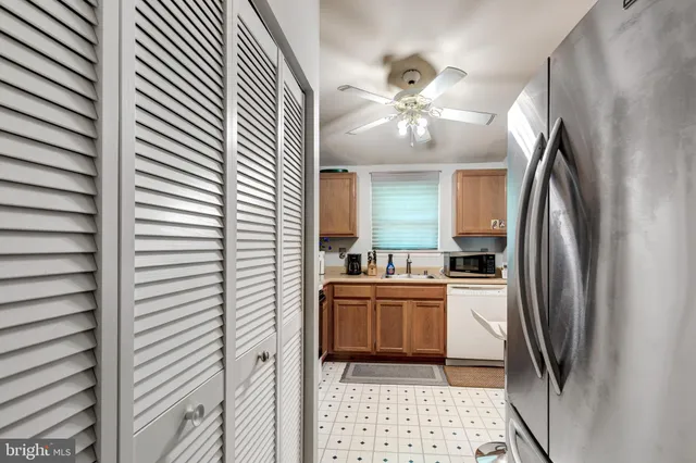 a kitchen with stainless steel appliances a refrigerator and a sink