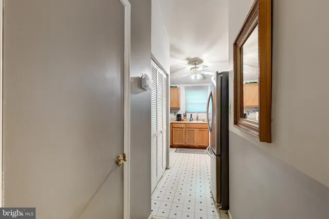 a bathroom with a glass door shower and a sink
