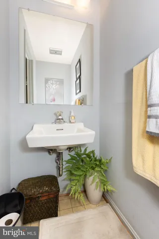 a dining room with furniture and a window