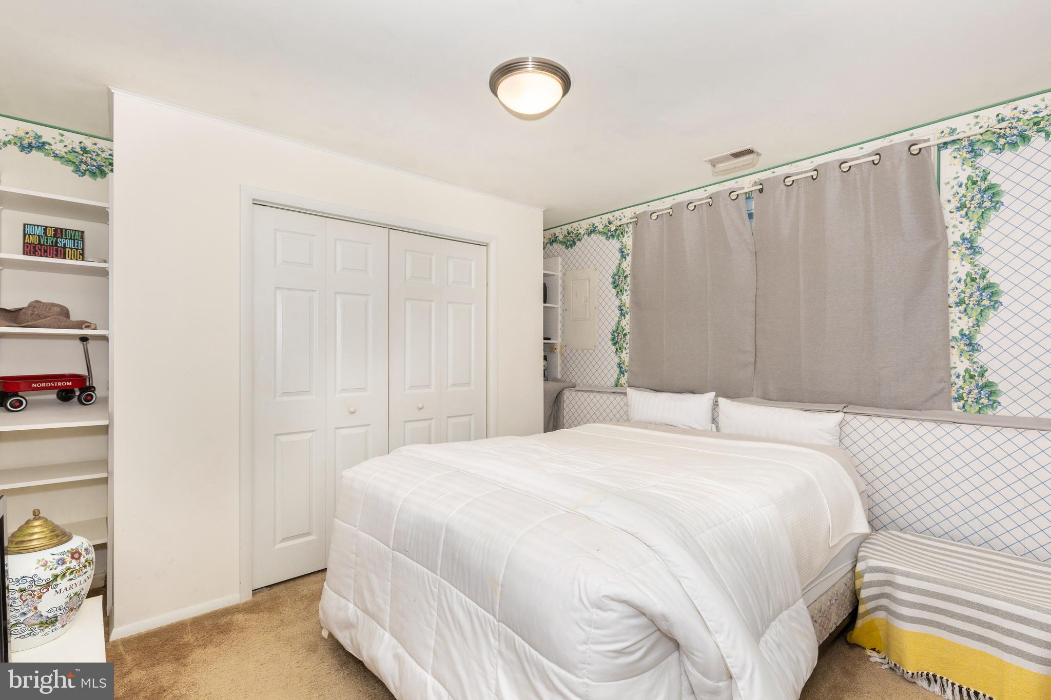 502 Brighton Place Baltimore, MD 21221 - Photo 18 of 42 a bedroom with a bed and a window