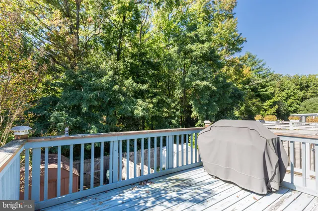 a view of balcony with wooden floor and fence