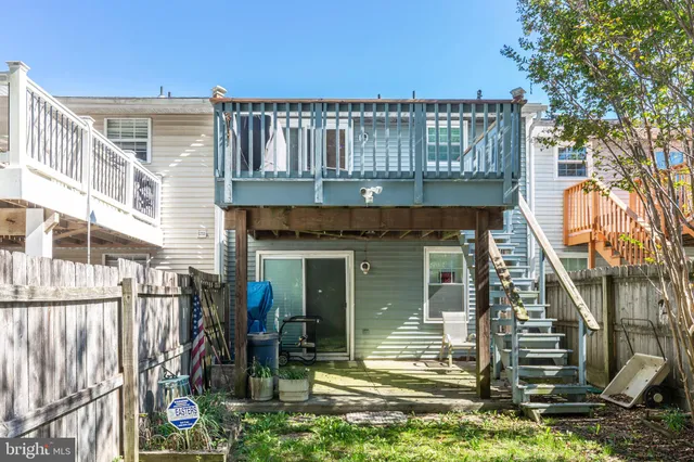a front view of a house with yard and green space