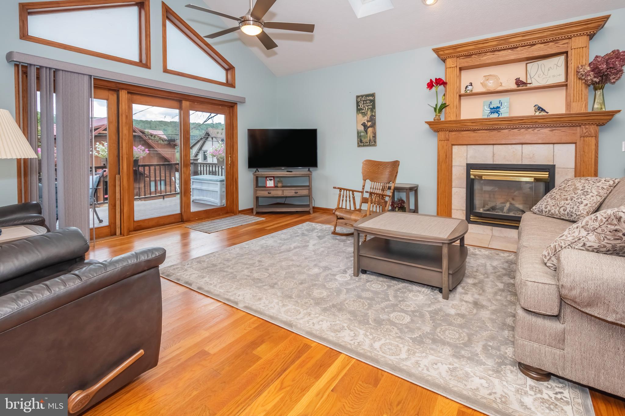 592 Marsh Hill Road McHenry, MD 21541 - Photo 15 of 51 a living room with furniture a flat screen tv and a fireplace
