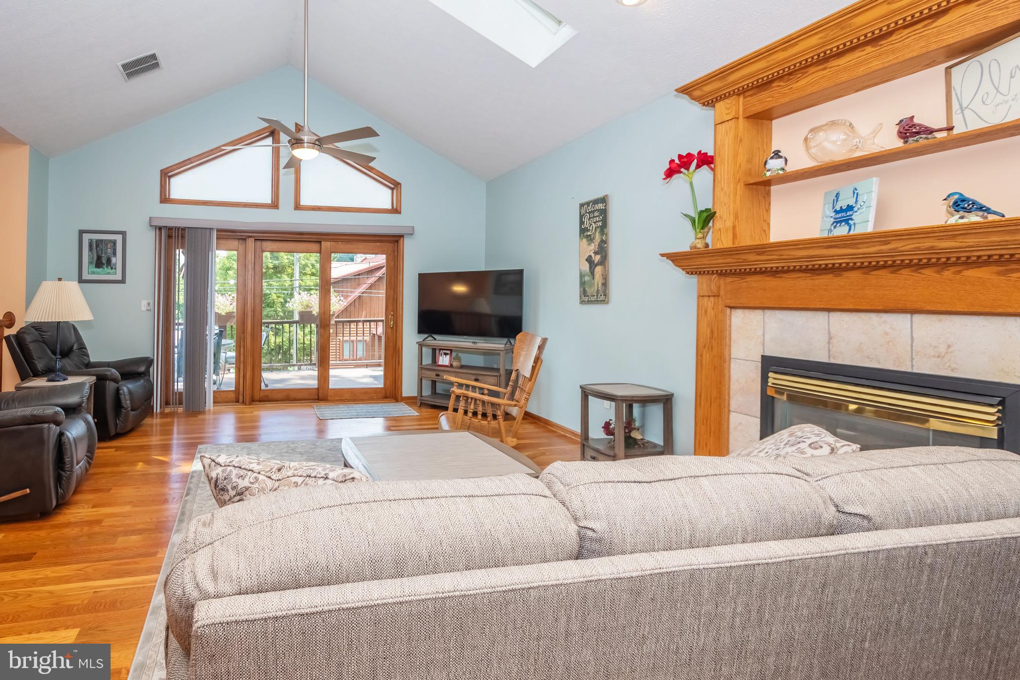 592 Marsh Hill Road McHenry, MD 21541 - Photo 18 of 51 a living room with a bed furniture and a flat screen tv