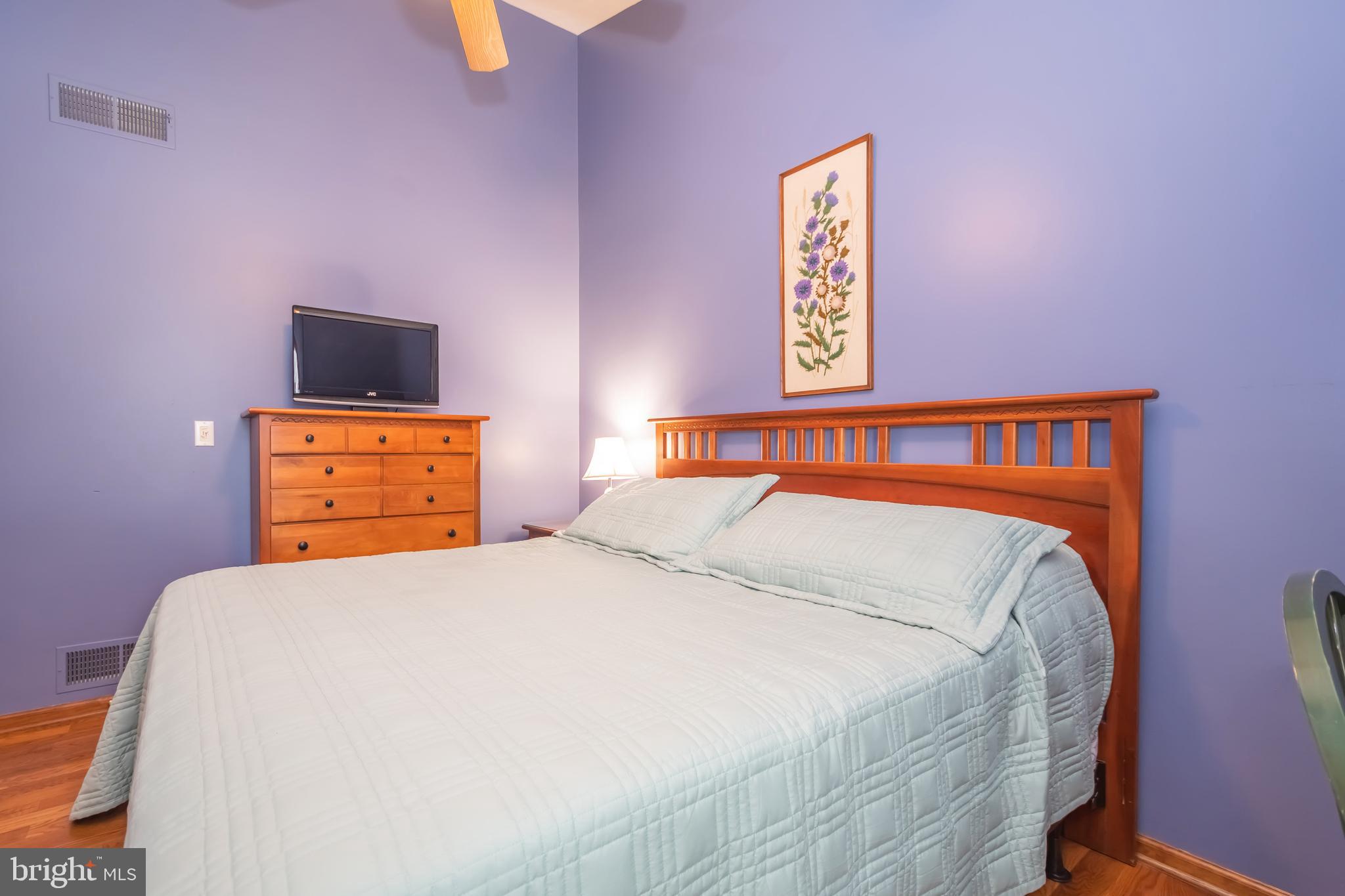 592 Marsh Hill Road McHenry, MD 21541 - Photo 23 of 51 a bedroom with a bed and a lamp