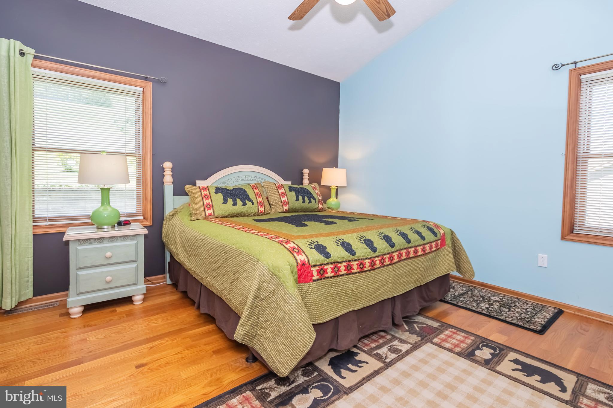 592 Marsh Hill Road McHenry, MD 21541 - Photo 26 of 51 a bed sitting in a bedroom next to a window