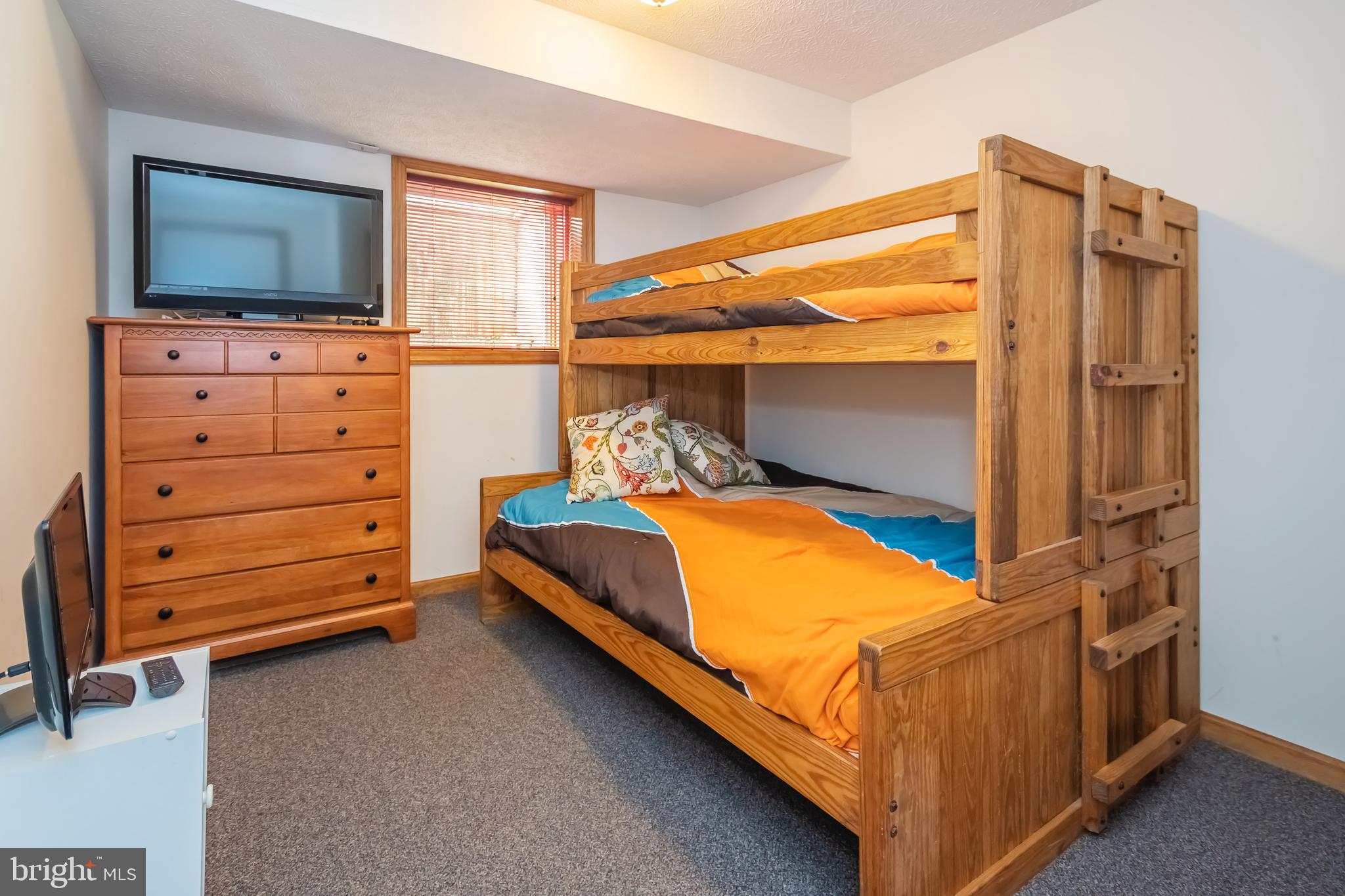 592 Marsh Hill Road McHenry, MD 21541 - Photo 30 of 51 a bedroom with a bed and flat screen tv