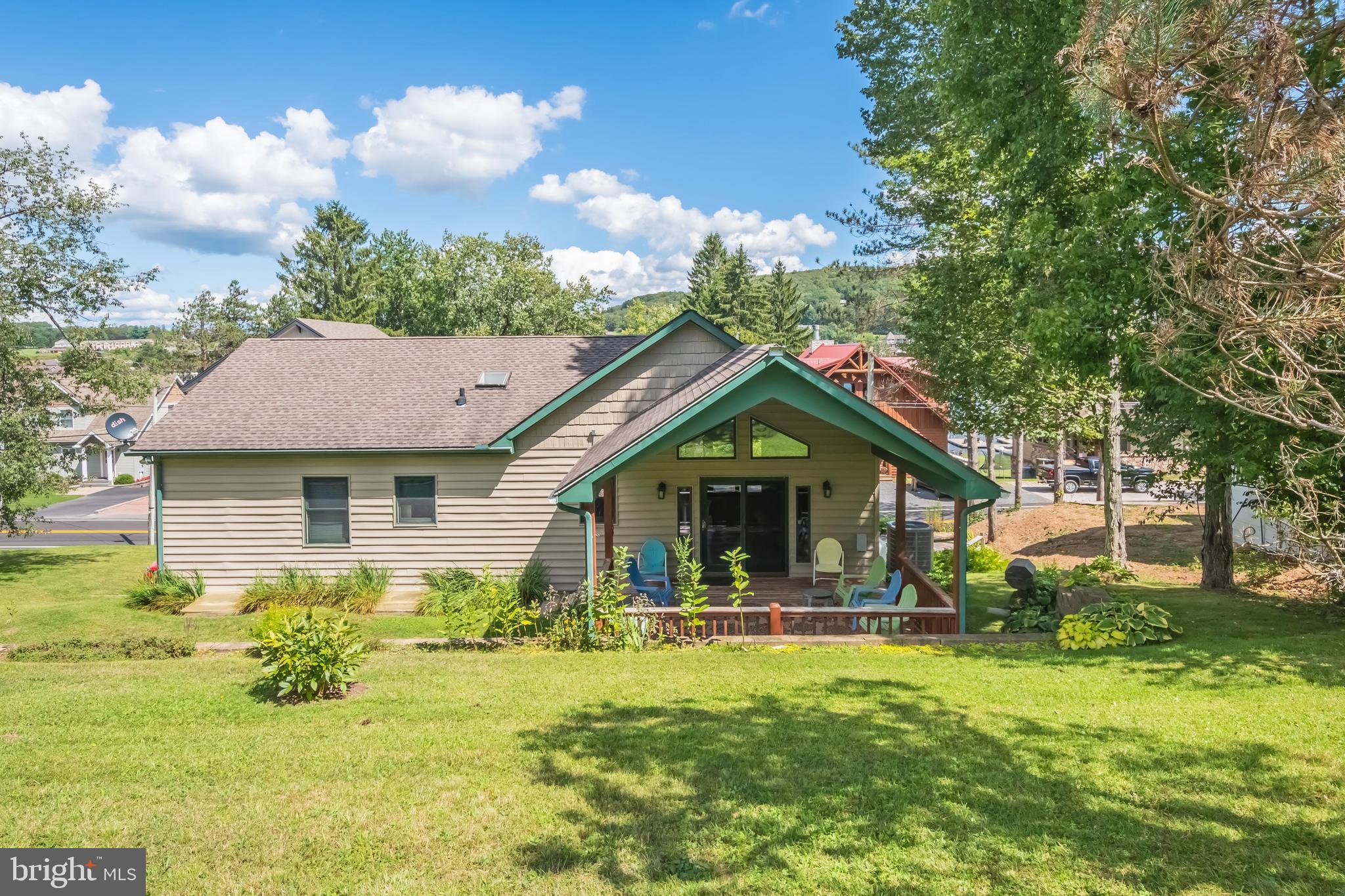 592 Marsh Hill Road McHenry, MD 21541 - Photo 42 of 51 a front view of a house with garden