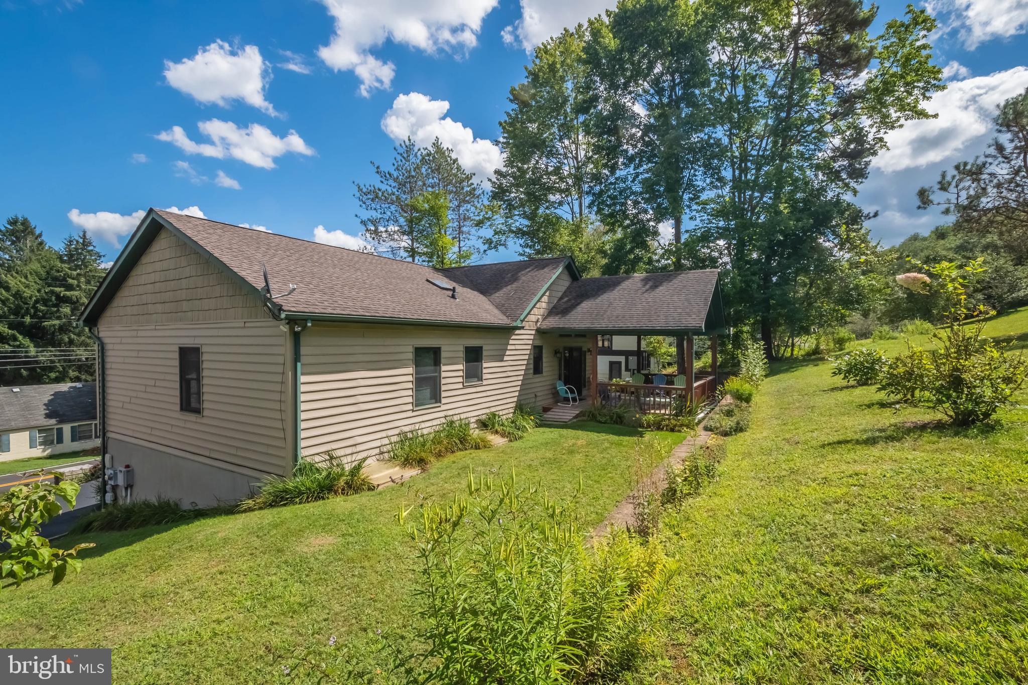 592 Marsh Hill Road McHenry, MD 21541 - Photo 43 of 51 a backyard of a house with table and chairs
