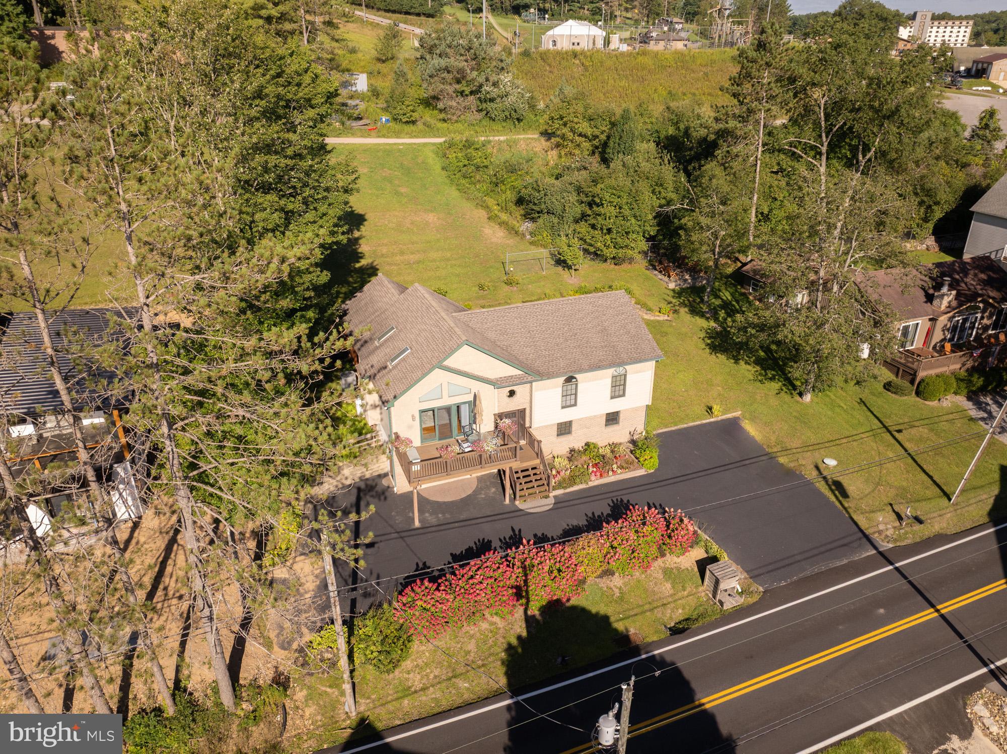 592 Marsh Hill Road McHenry, MD 21541 - Photo 48 of 51 a view of a balcony with chair and table of the ocean