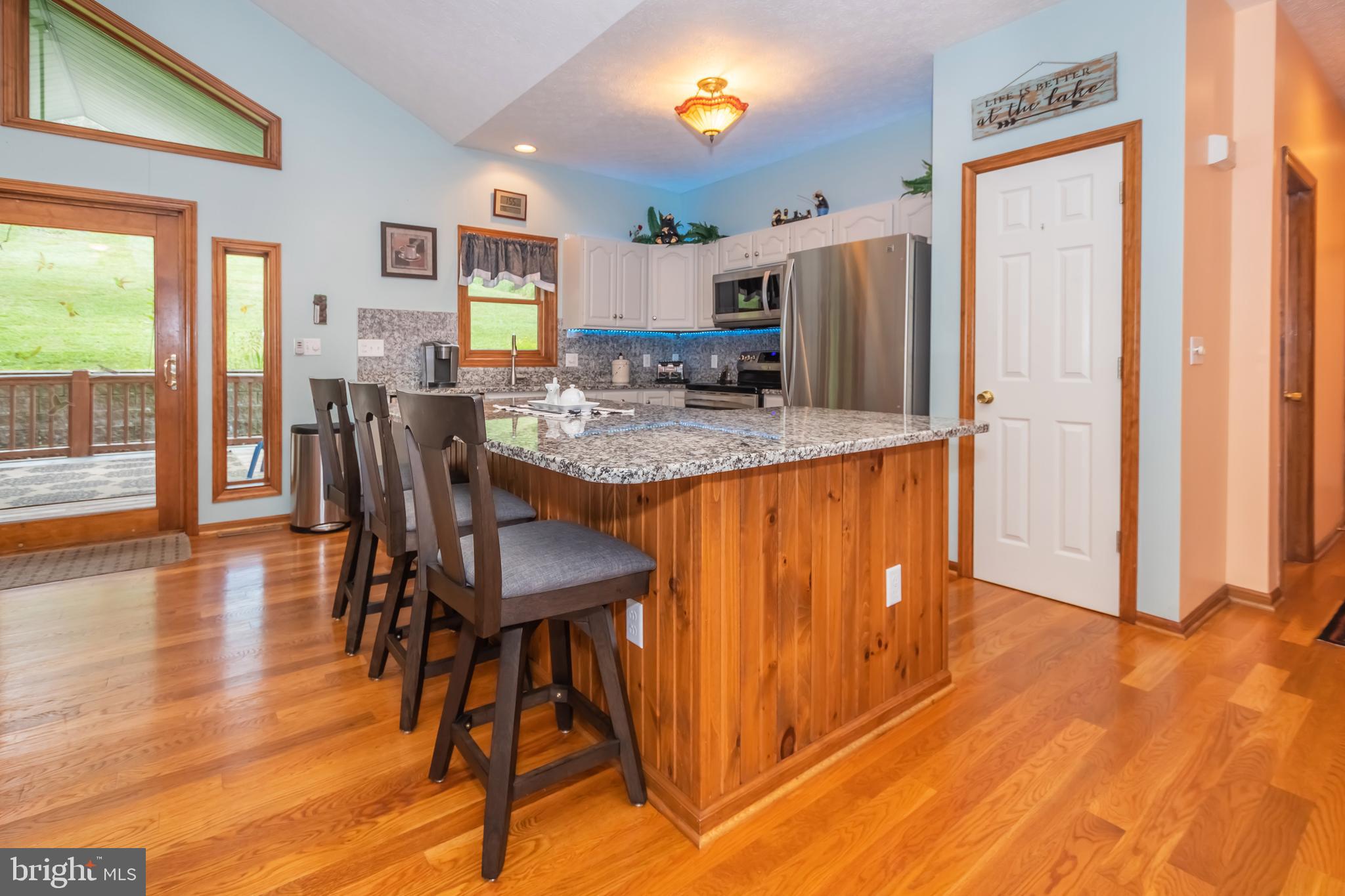 592 Marsh Hill Road McHenry, MD 21541 - Photo 6 of 51 a view of a dining room with furniture and wooden floor