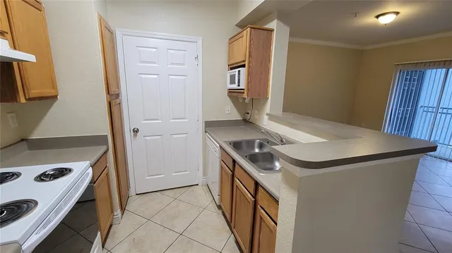 a kitchen with a stove and a refrigerator