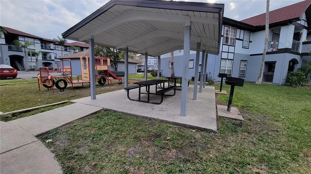 a front view of a house with plants