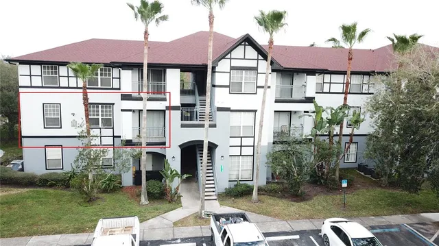 an aerial view of residential houses with outdoor space and lake view