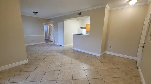 a view of an empty room with a bathroom