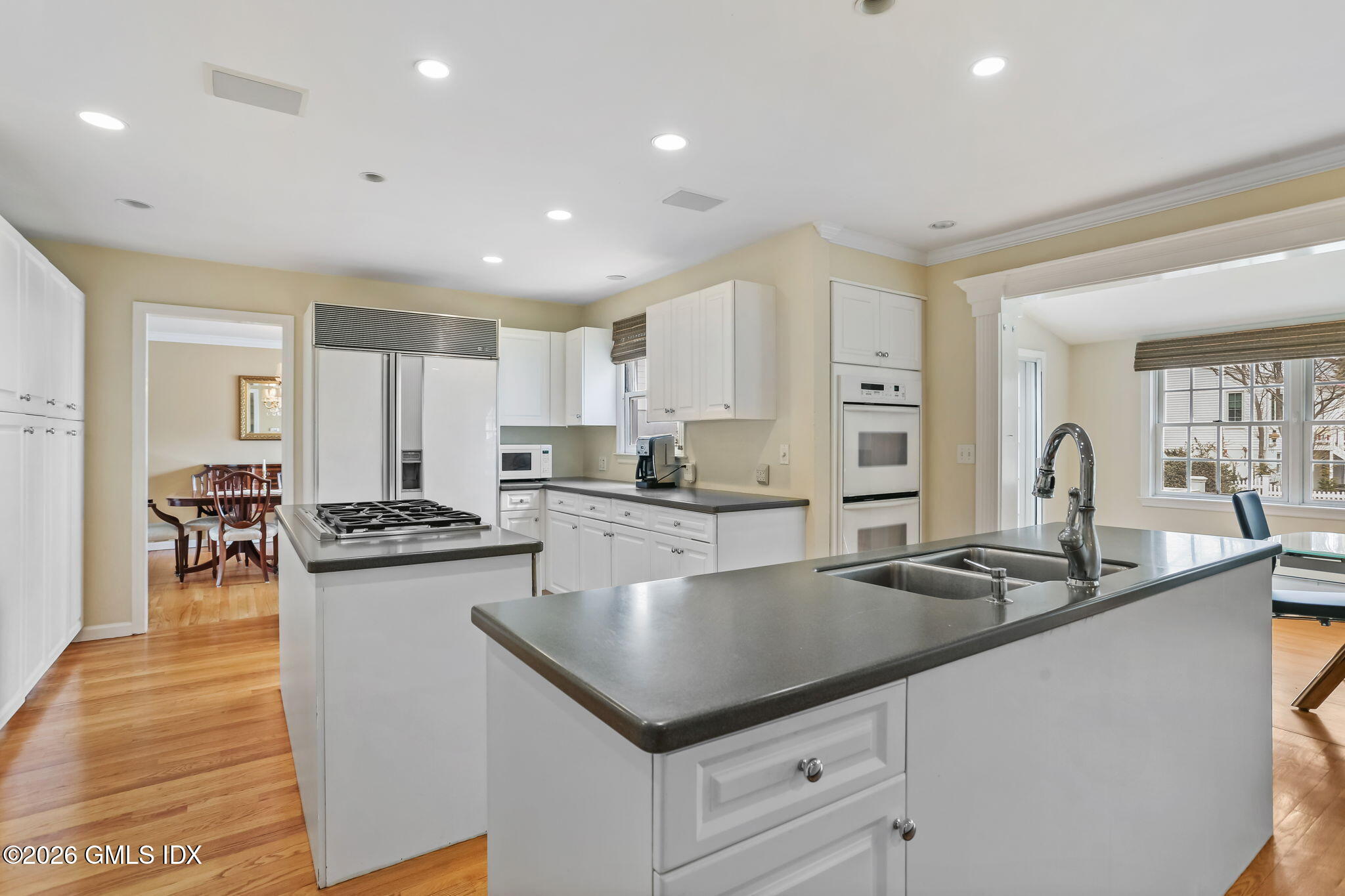 153 Lockwood Road Riverside, CT 06878 - Photo 21 of 58 a kitchen with stainless steel appliances granite countertop a sink a stove and a refrigerator