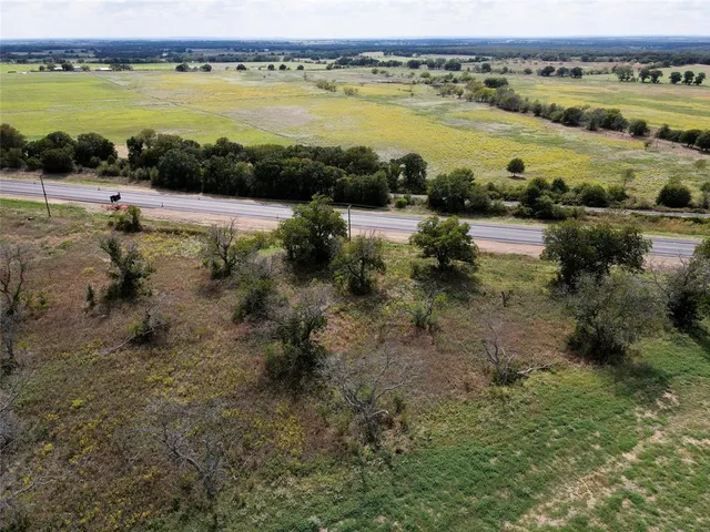 a view of a lake with beach and city view