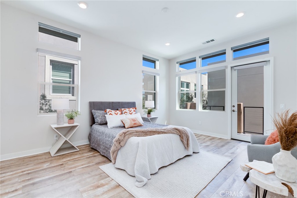 800 Beacon Irvine, CA 92618 - Photo 21 of 49 a bedroom with a large bed and a window