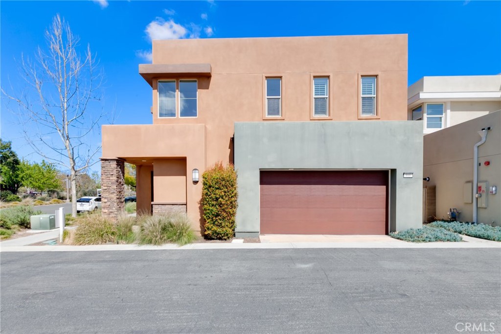 800 Beacon Irvine, CA 92618 - Photo 4 of 49 a front view of a house with a yard and garage