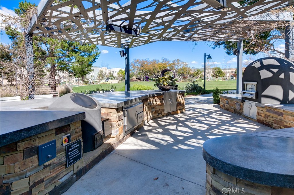 800 Beacon Irvine, CA 92618 - Photo 45 of 49 a view of a patio with a table chairs and a barbeque