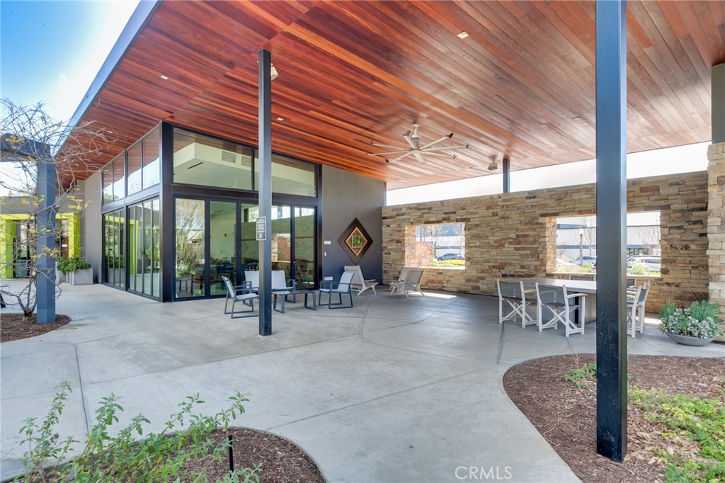 800 Beacon Irvine, CA 92618 - Photo 47 of 49 a view of a patio with table and chairs and potted plants