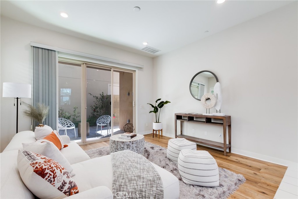800 Beacon Irvine, CA 92618 - Photo 8 of 49 a living room with furniture and a potted plant