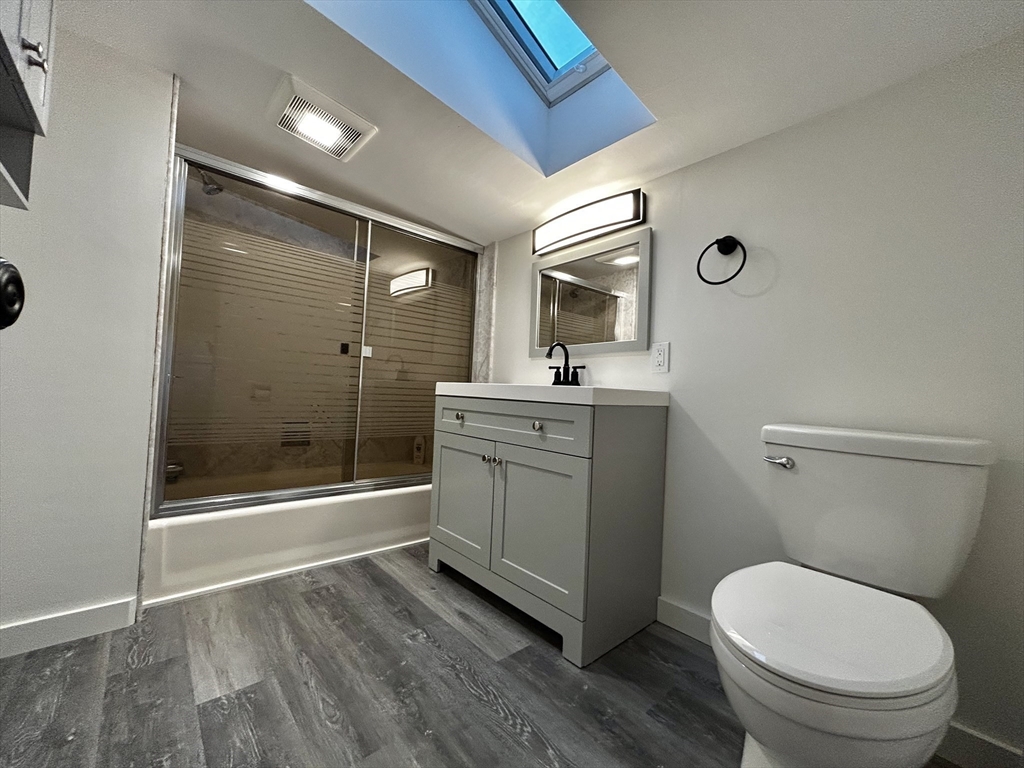 46 Elm Street, Unit 2 Buckland, MA 01370 - Photo 12 of 15 a bathroom with a toilet a sink and shower