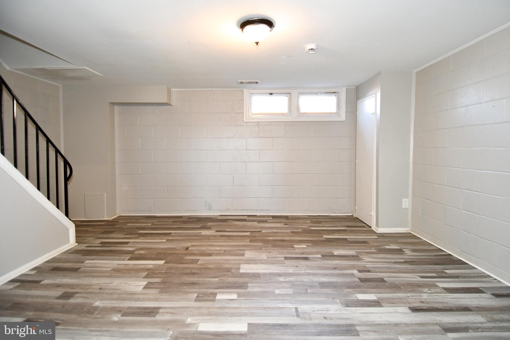 4223 Labyrinth Road Baltimore, MD 21215 - Photo 19 of 22 a view of a livingroom with wooden floor
