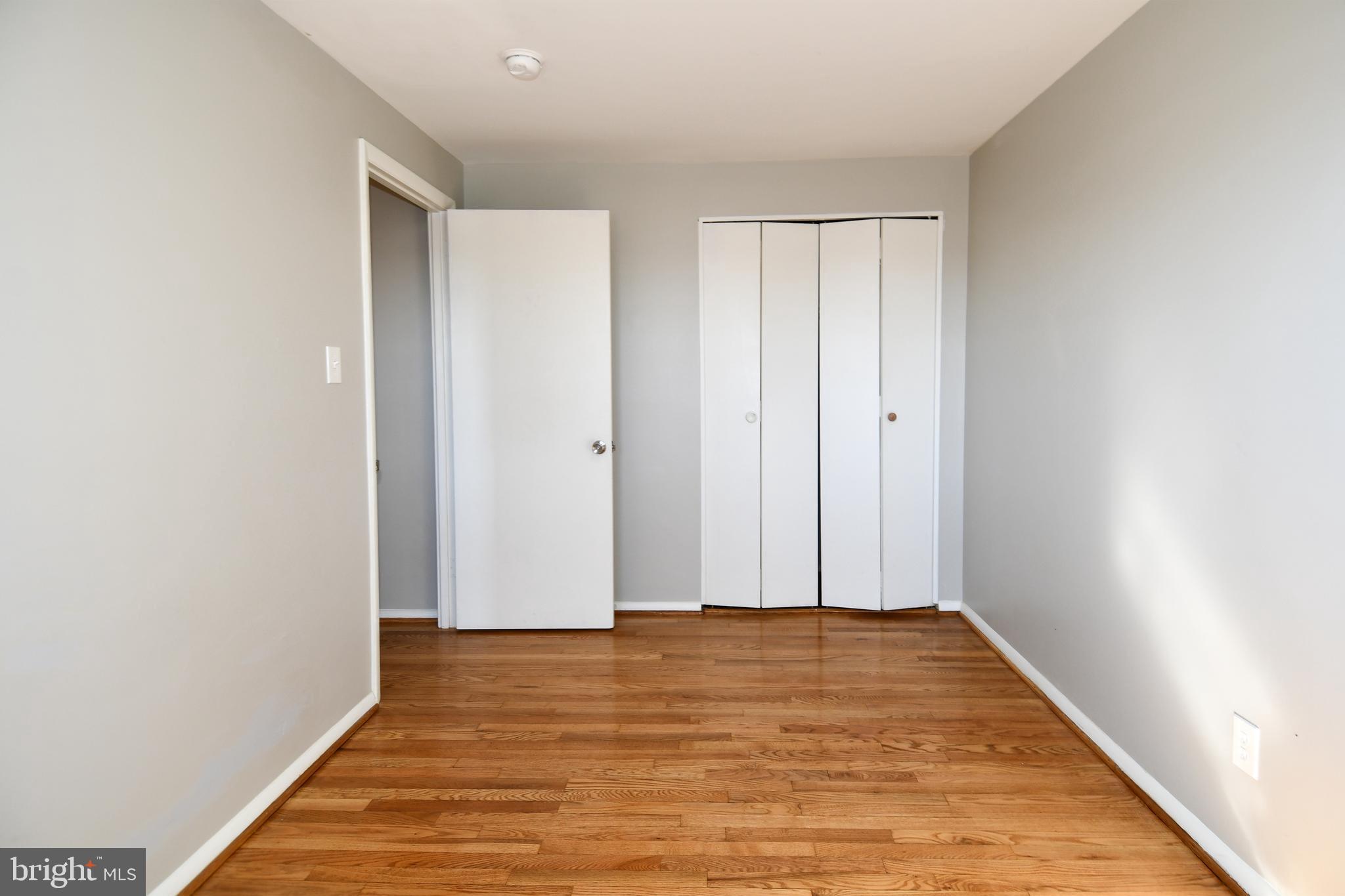 4223 Labyrinth Road Baltimore, MD 21215 - Photo 10 of 22 a view of room with wooden floor