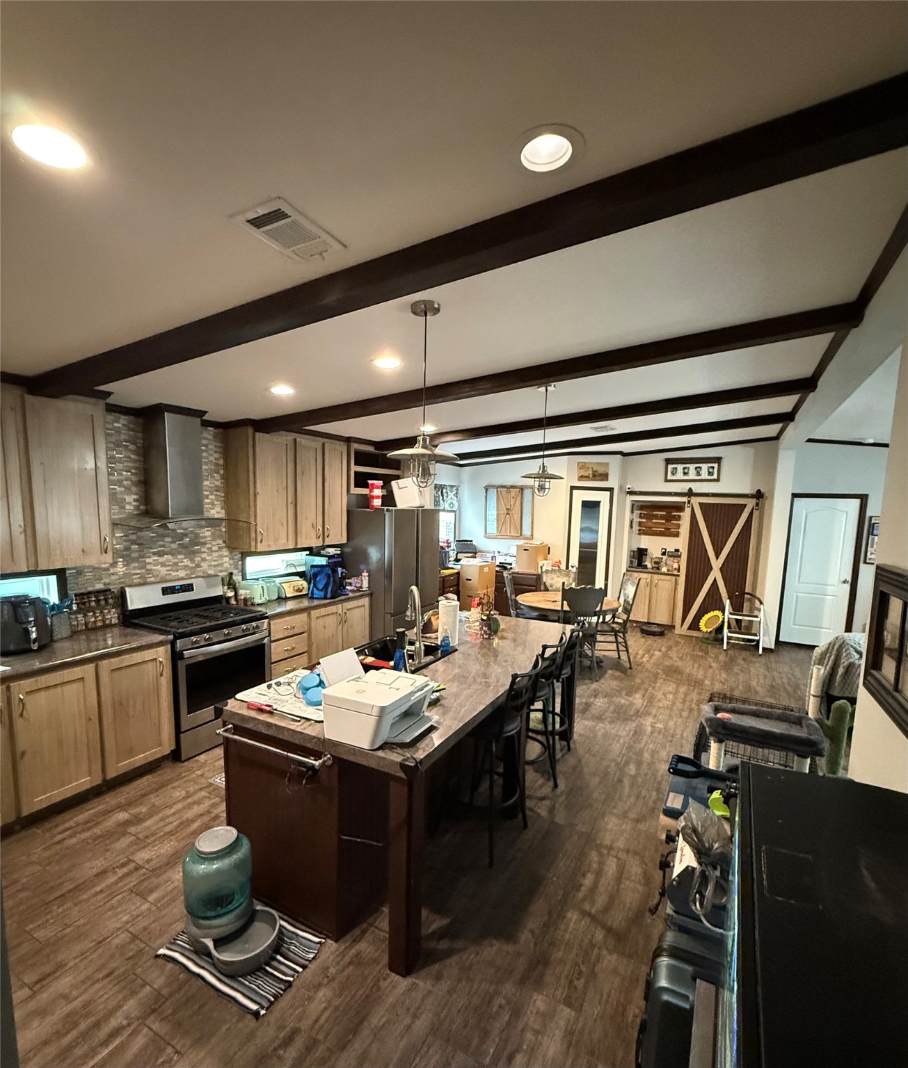 178 Commanche Drive Onalaska, TX 77360 - Photo 12 of 18 a kitchen with counter space dining table and stainless steel appliances