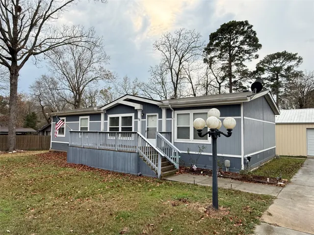 a house with trees in the background