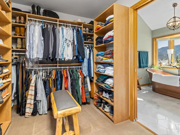 a view of living room with furniture and floor to ceiling windows