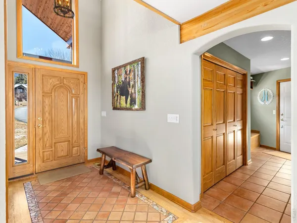 a view of a entryway door with interior of the house