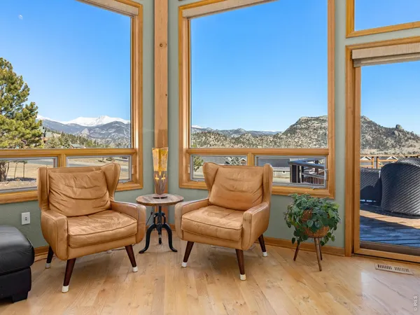 a dining area with a table and chairs