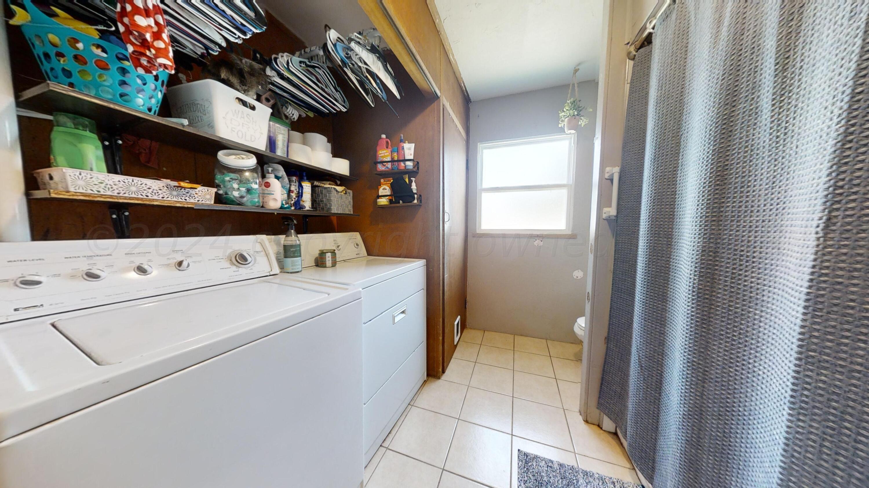 5311 Tumbleweed Drive Amarillo, TX 79110 - Photo 9 of 13 a utility room with dryer and washer