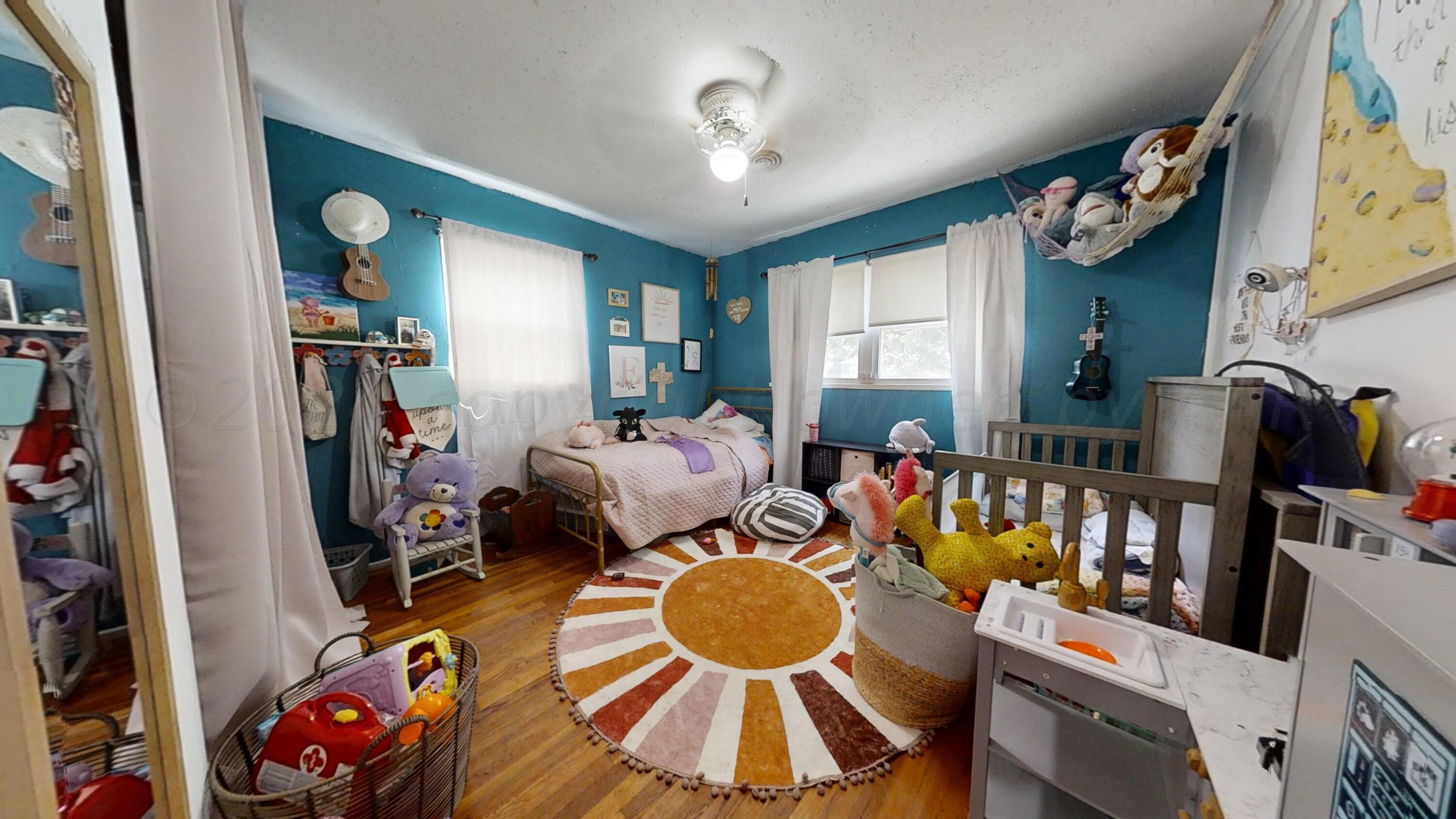 5311 Tumbleweed Drive Amarillo, TX 79110 - Photo 10 of 13 a living room with furniture and a mirror