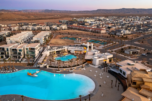 762 West Periwinkle Lane, Unit 102 St. George, UT 84790 - Photo 36 of 40 Drone / aerial view of a pool area and a mountainous background