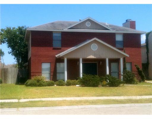 2822 Toronto Drive Corpus Christi, TX 78414 - Photo 1 of 6 a front view of a house with a yard
