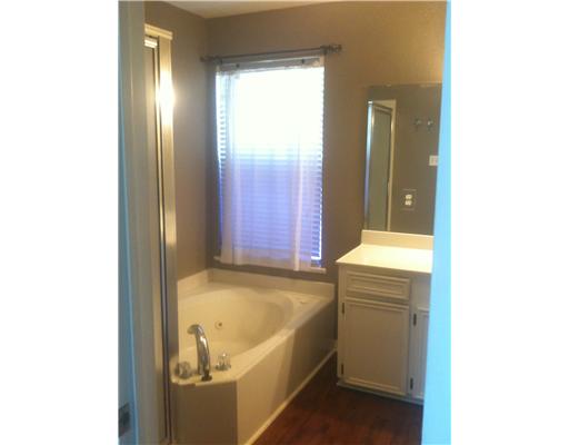 2822 Toronto Drive Corpus Christi, TX 78414 - Photo 4 of 6 a bathroom with a tub and sink