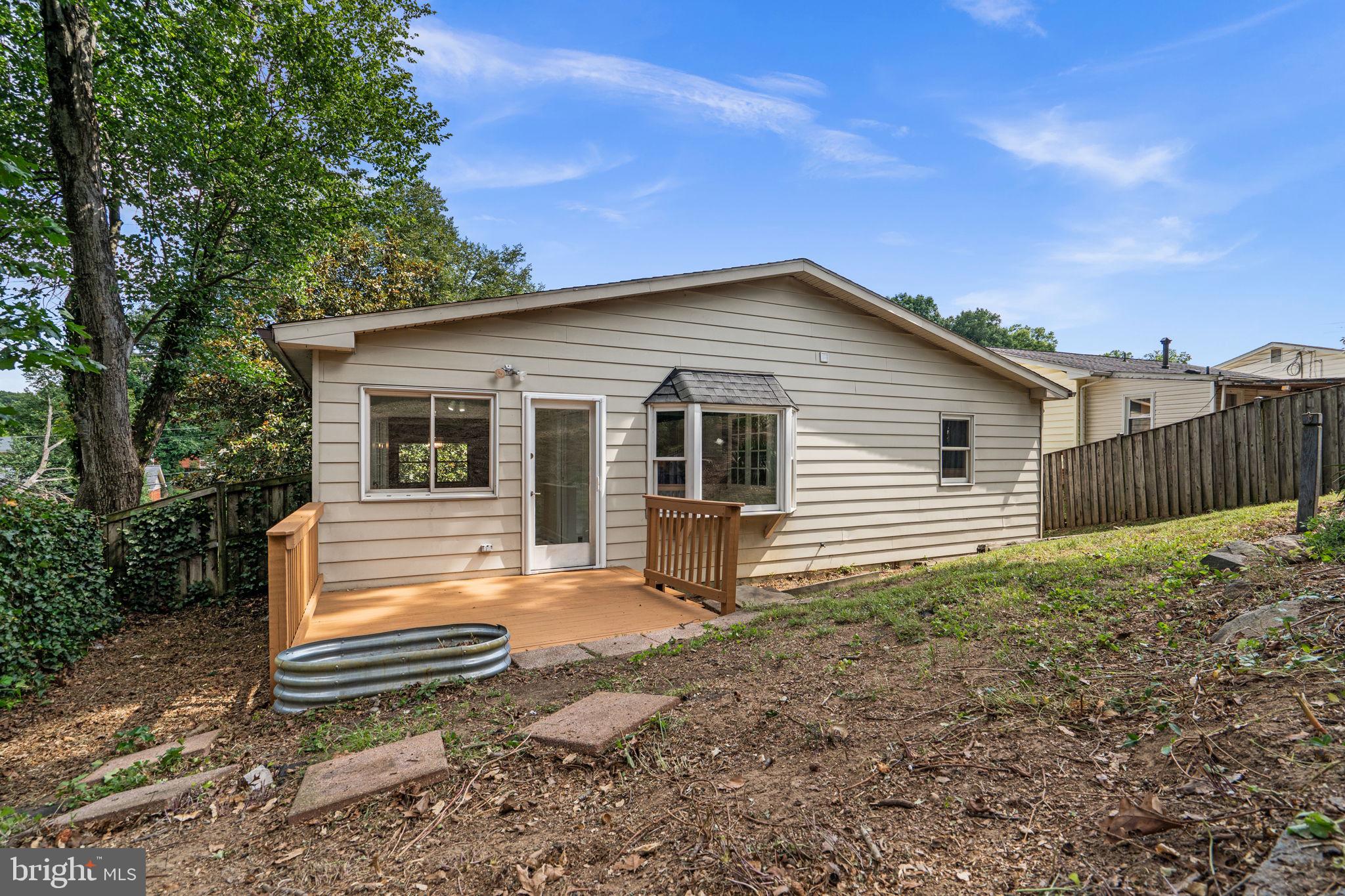 822 Loxford Terrace Silver Spring, MD 20901 - Photo 55 of 61 a view of a house with a yard and wooden fence