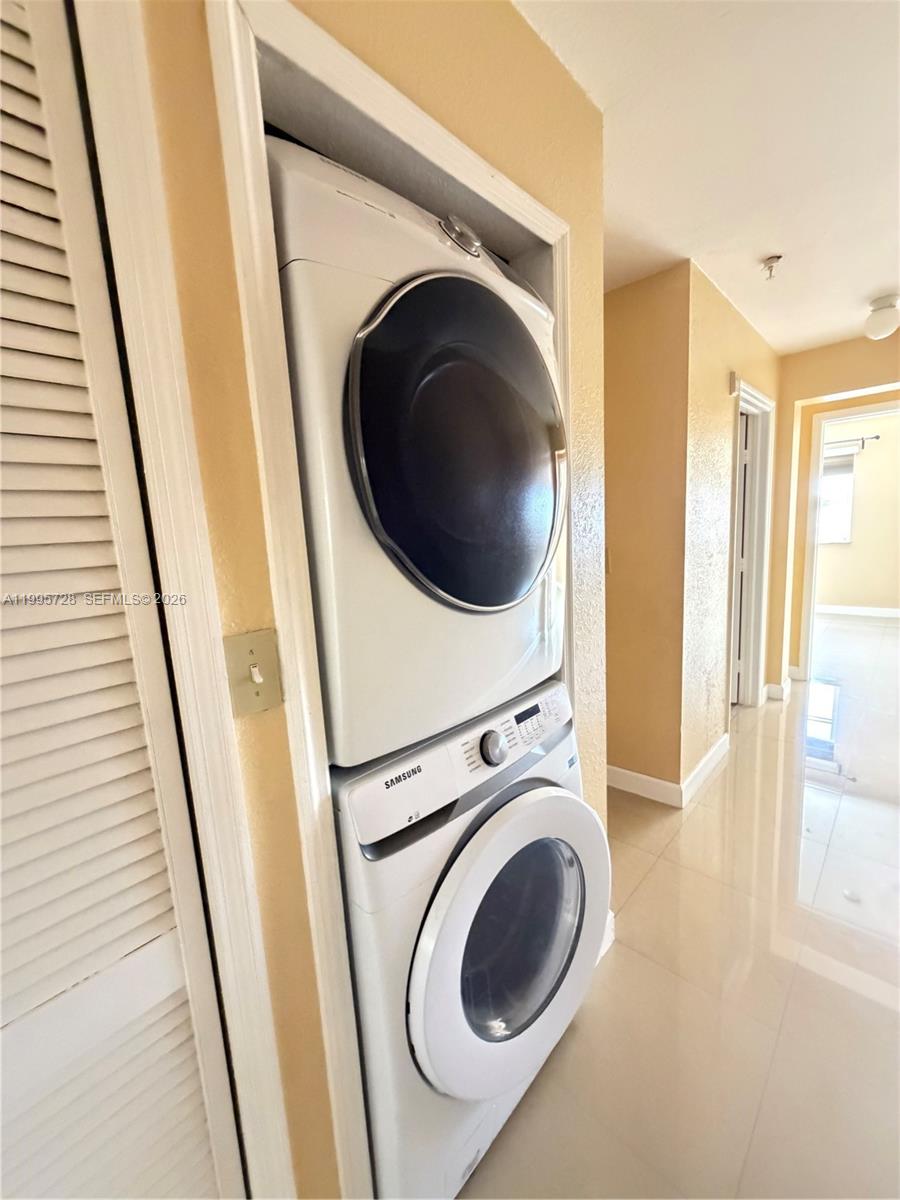7080 Northwest 177th Street, Unit 20913 Hialeah, FL 33015 - Photo 15 of 15 a view of a hallway with washer and dryer