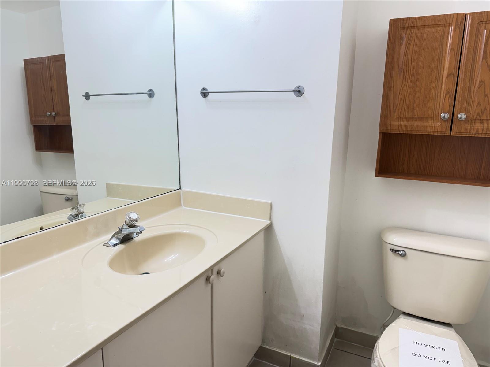 7080 Northwest 177th Street, Unit 20913 Hialeah, FL 33015 - Photo 8 of 15 a bathroom with a sink toilet and shower
