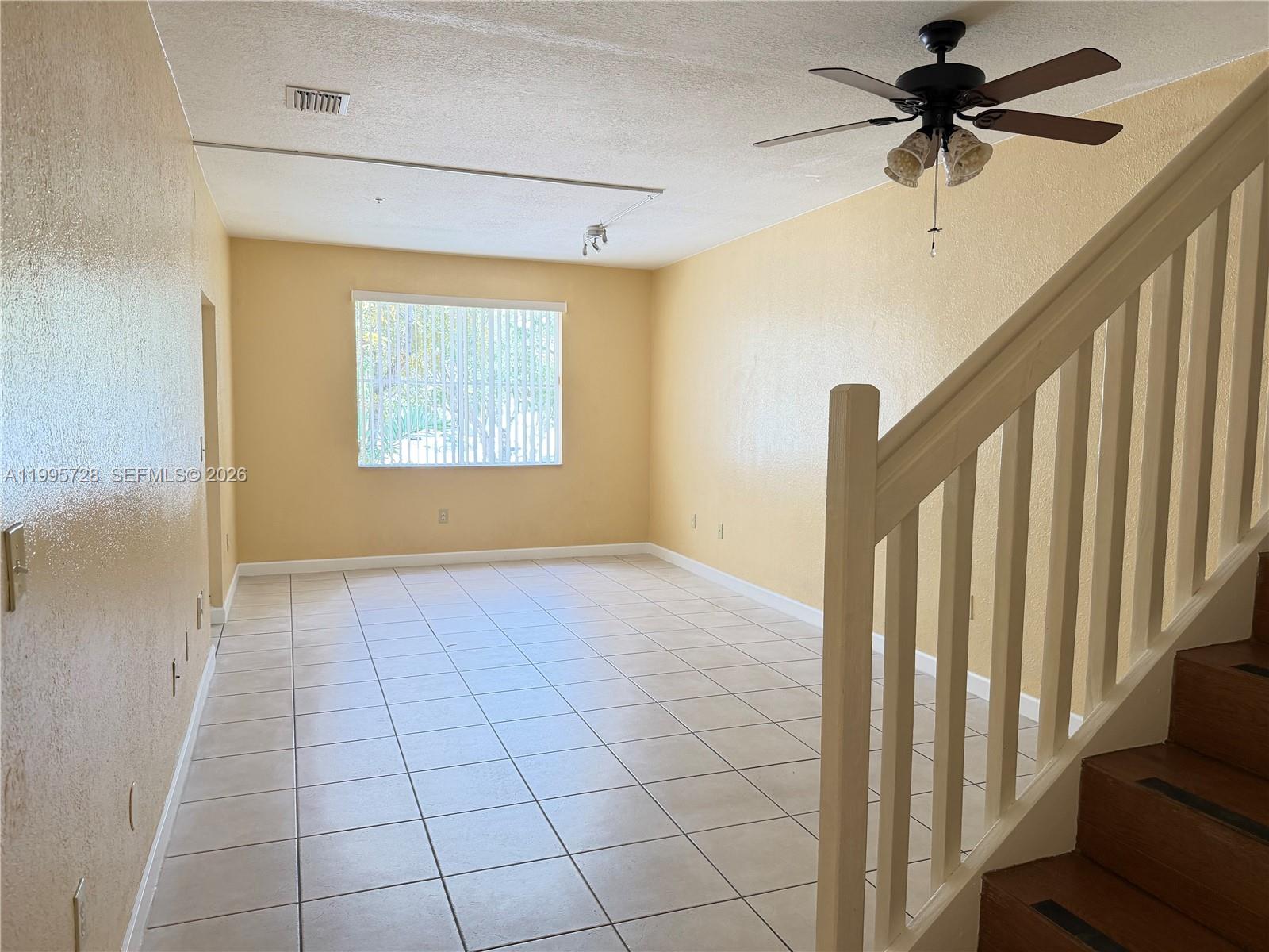 7080 Northwest 177th Street, Unit 20913 Hialeah, FL 33015 - Photo 9 of 15 a view of an empty room with a window