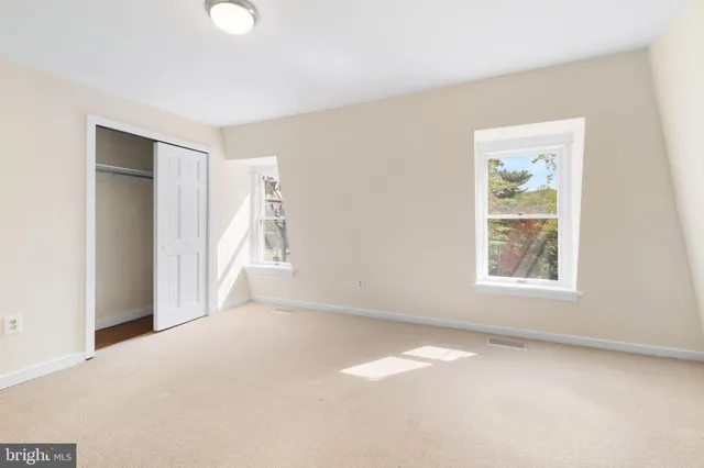 a view of a bathroom from a hallway
