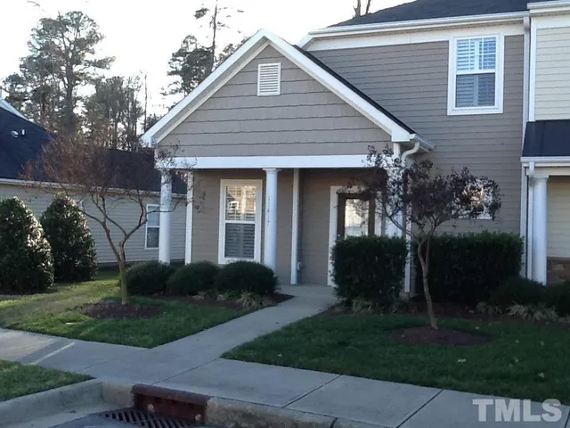 a view of a house with garden and plants